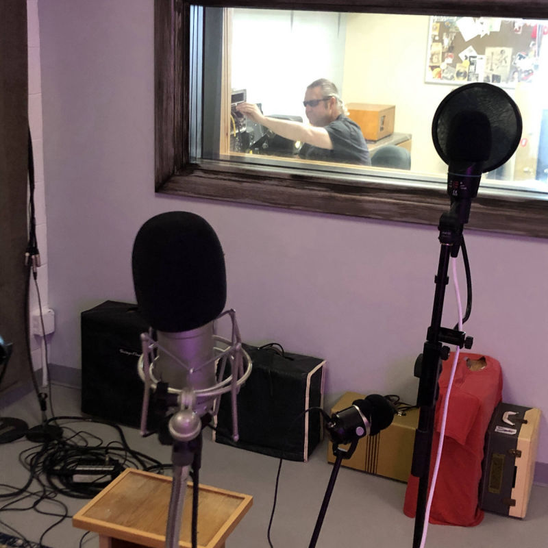 Tom Page working behind a window